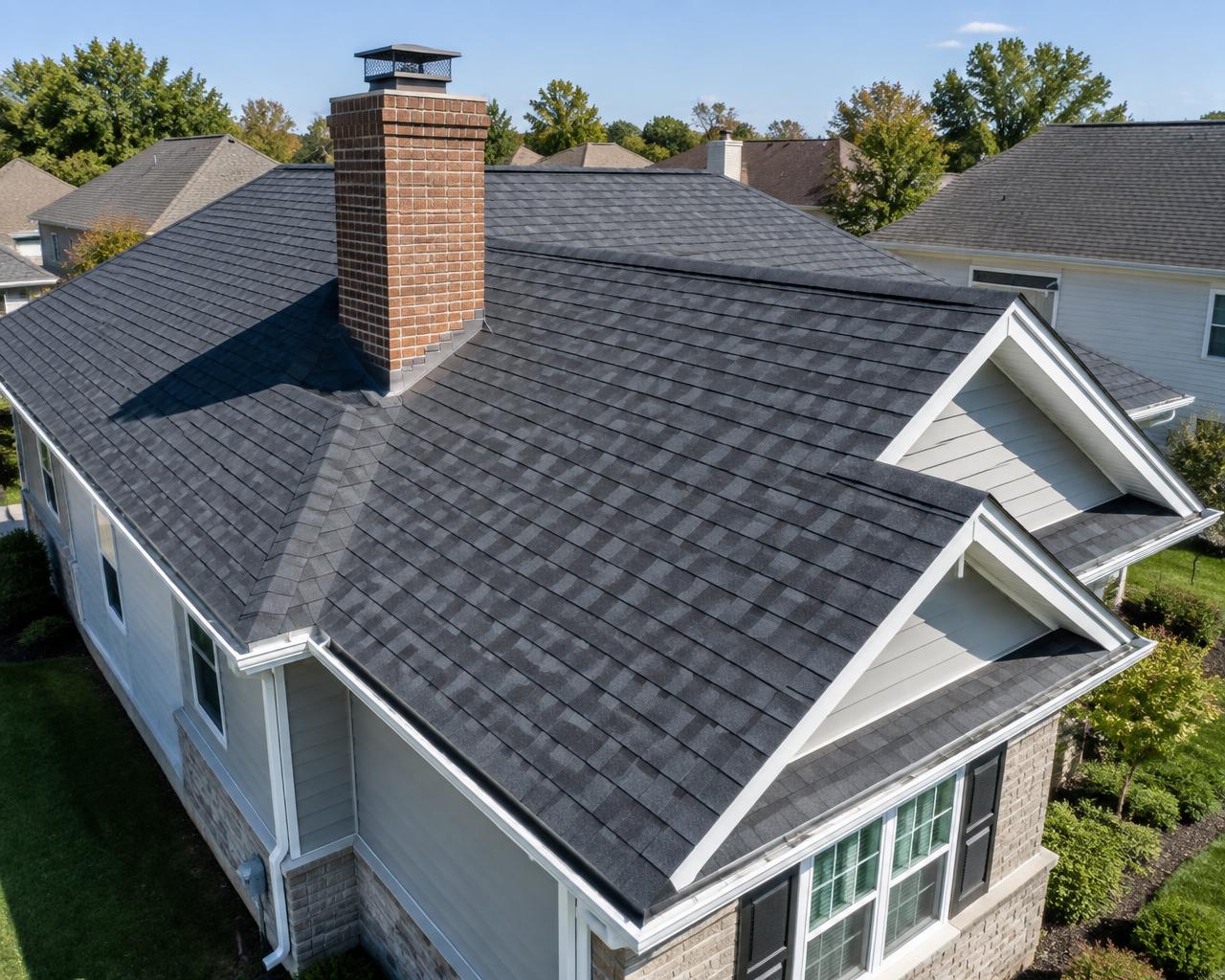 Completed residential roof and chimney installation